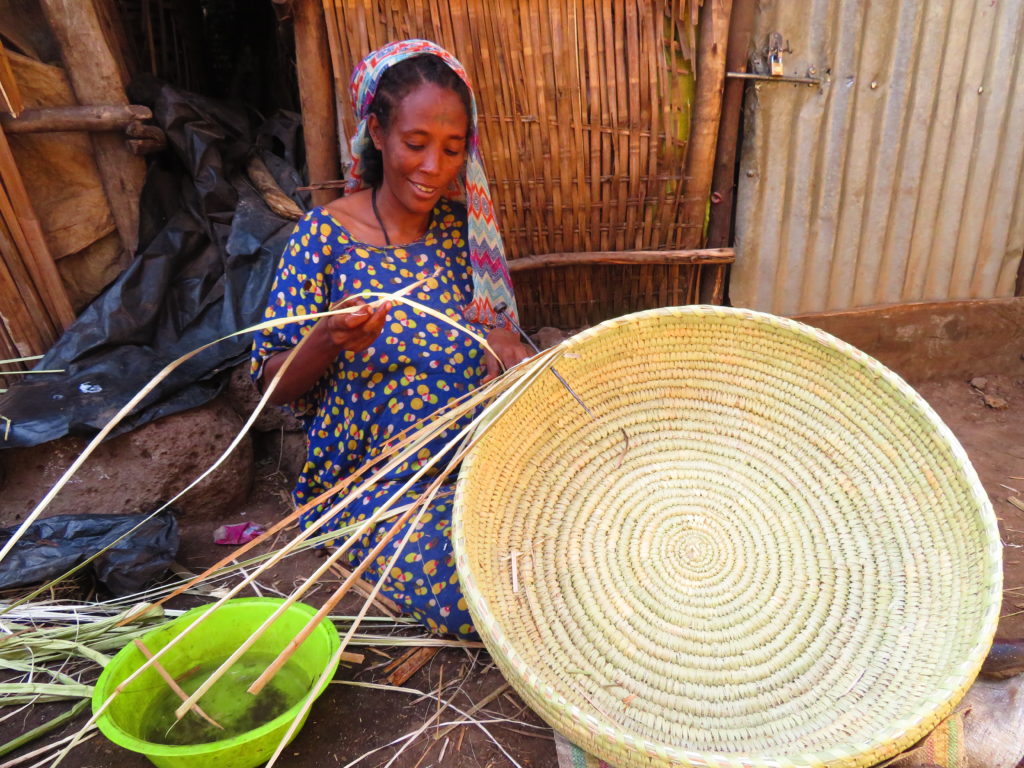 Woman weaving basket